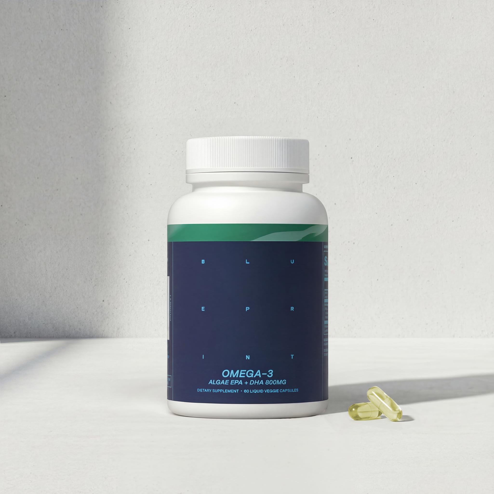 Blueprint Bryan Johnson Omega-3 Vegan Supplement on a wooden table