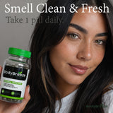 BodyBreeze Chlorophyll Capsules in lifestyle setting with fresh herbs