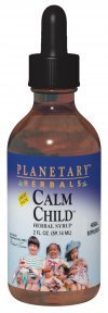 Bottle of Planetary Herbals Calm Child on a wooden table
