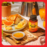 Bragg ACV Capsules 100g lifestyle scene with water