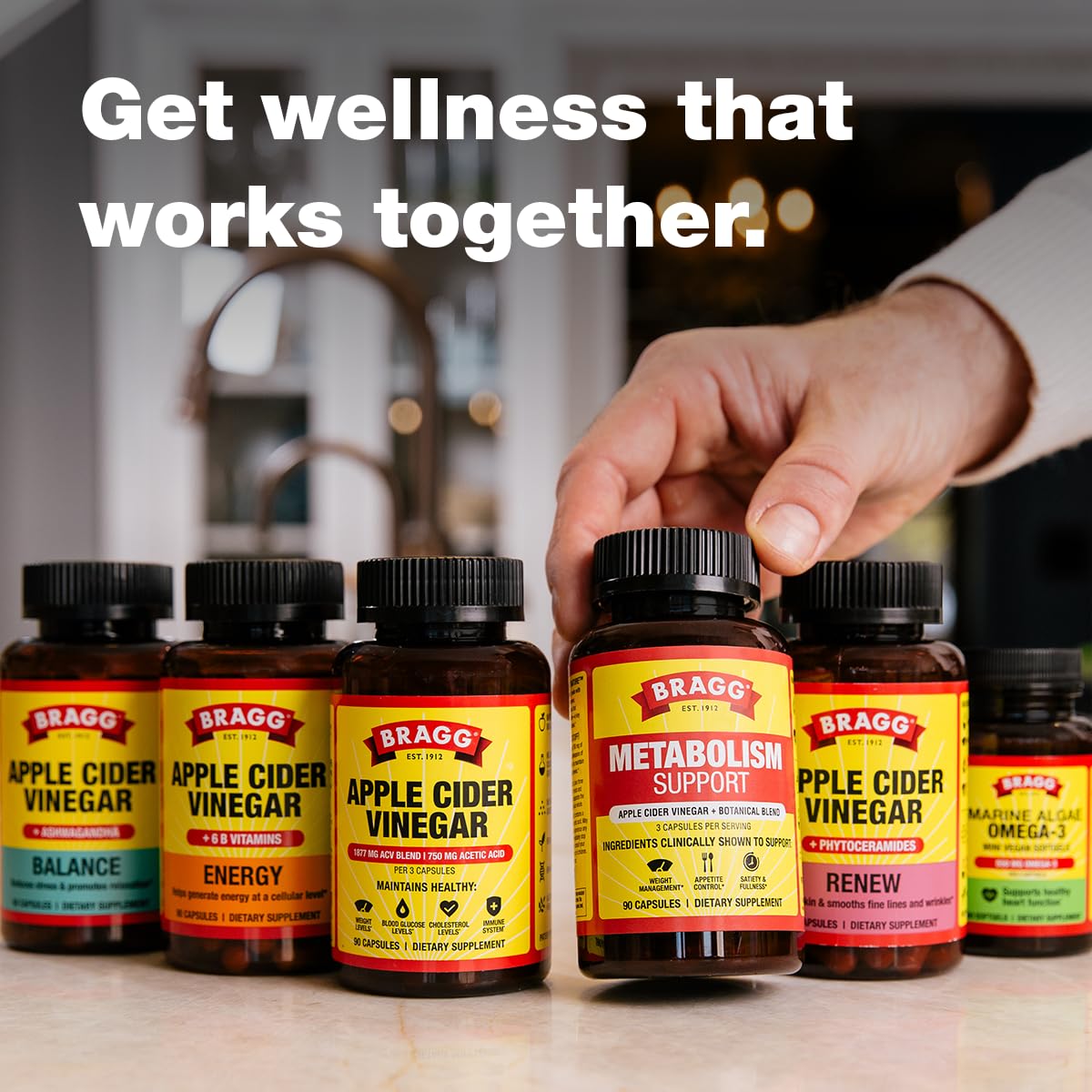 Bragg ACV Capsules 100g packaging on a wooden table