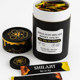 BRILLURE Shilajit Honey Stick next to a cup of tea