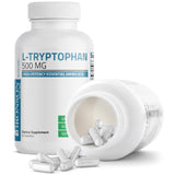 Bronson L-Tryptophan 500mg supplement capsules on a wooden surface