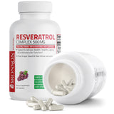 Bronson Resveratrol Complex 500 MG capsules on a wooden surface