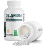 Bronson Selenium 200 MCG capsules displayed with a glass of water