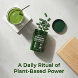 Bruiseweed Spirulina & Chlorella Daily Greens Blend tablets on a wooden table
