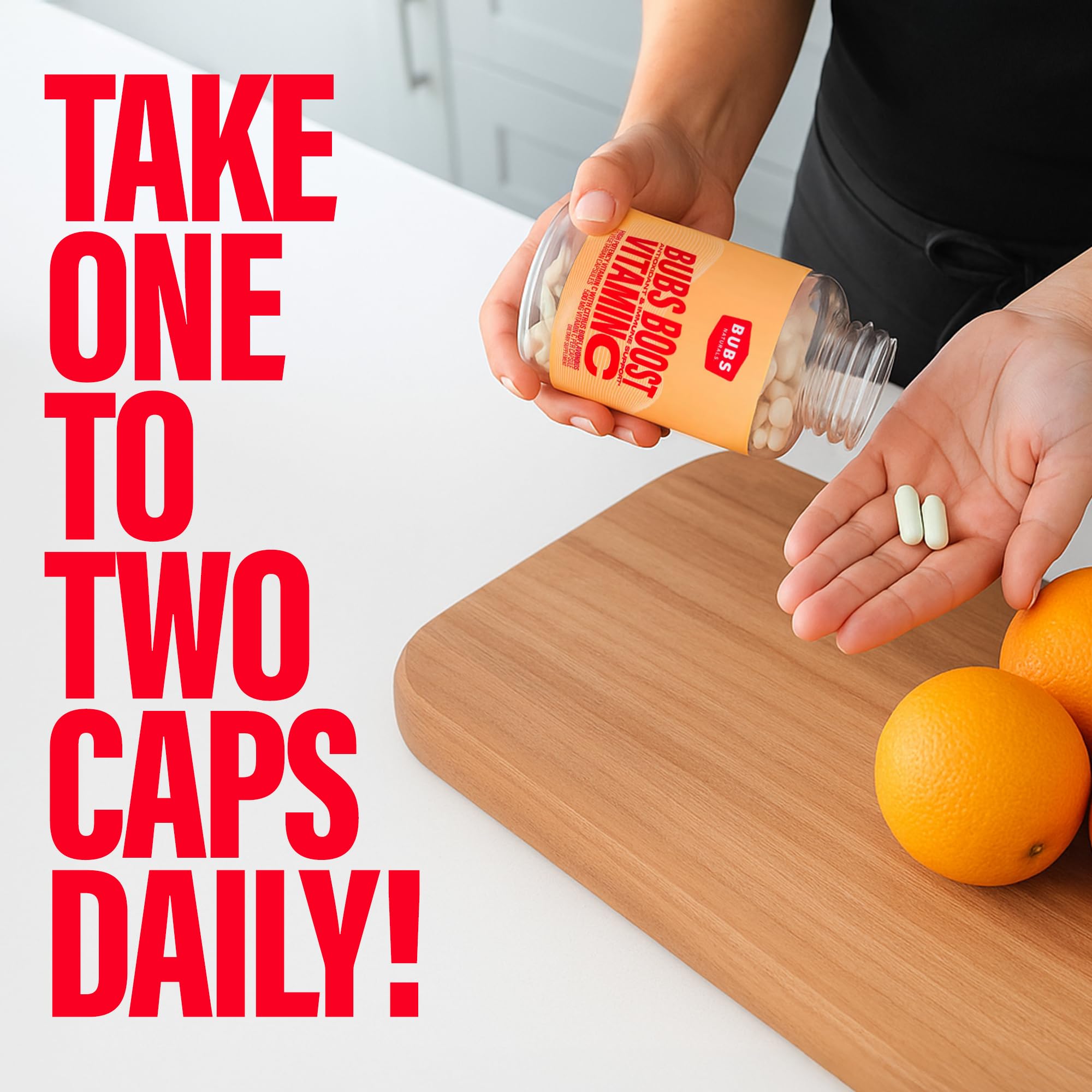 BUBS Naturals Vitamin C capsules in a spoon