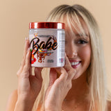 Bucked Up Babe Pre-Workout Powder 442g on gym equipment