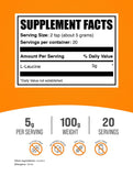 BulkSupplements L-Leucine Powder 5000mg side view with scoop
