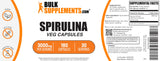 BulkSupplements Spirulina 3000mg Capsules with natural background