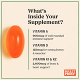 Bulletproof Vitamins A-D-K softgels on a wooden table
