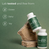 ByeBS daily Support Supplement in a lifestyle setting with a glass of water