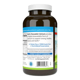 Carlson Calcium Chewable 250mg vanilla flavour with a glass of water