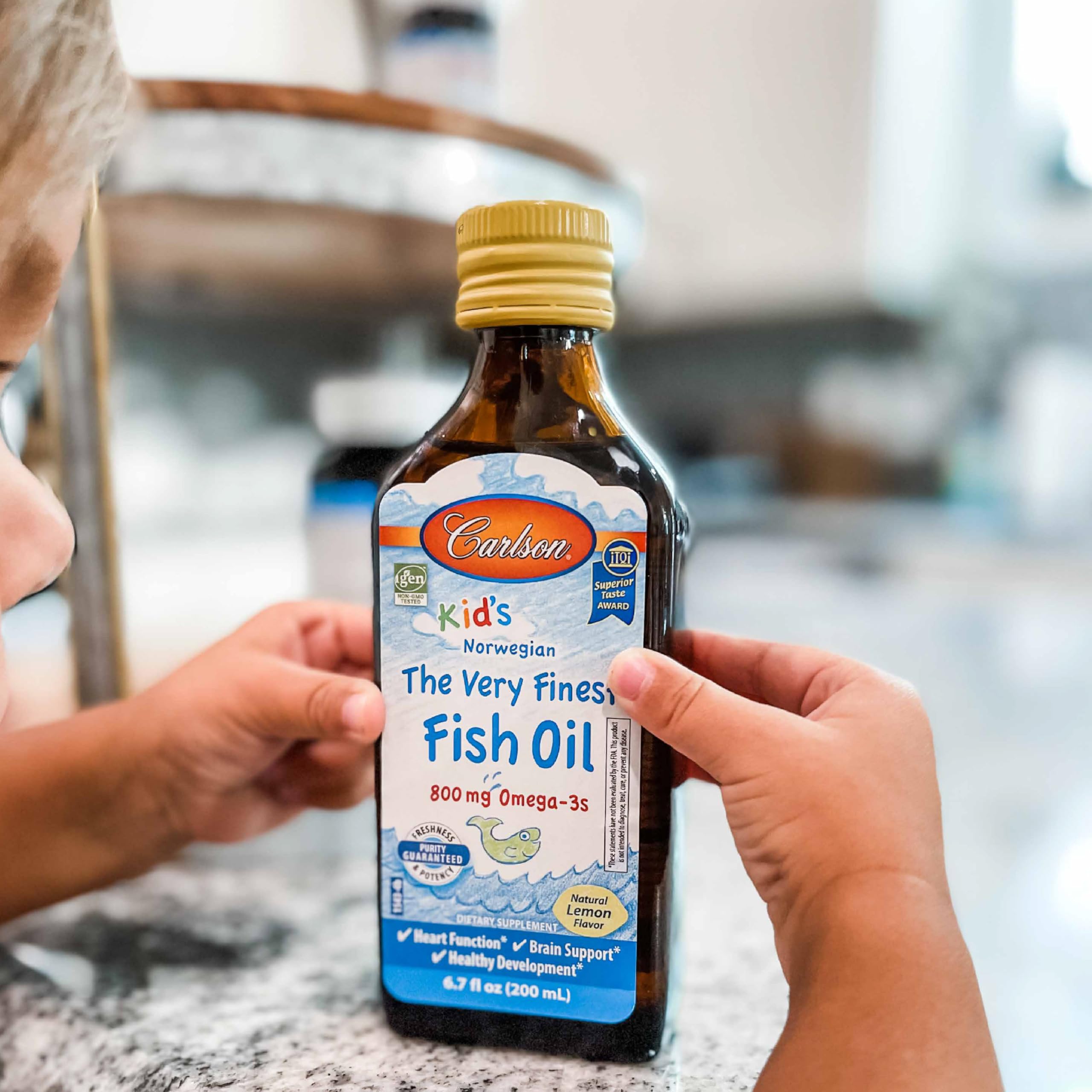 Carlson Kid's The Very Finest Fish Oil with a child enjoying it