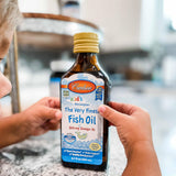 Carlson Kid's The Very Finest Fish Oil with a child enjoying it