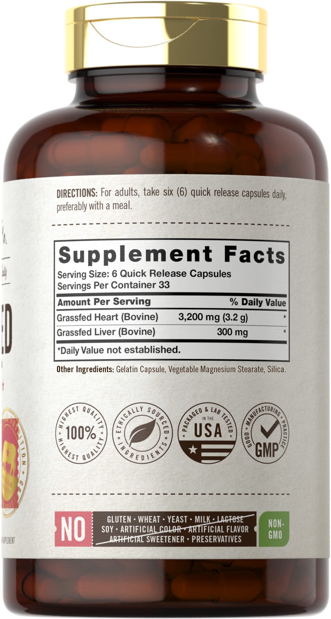 Carlyle Grassfed Heart Supplement capsules in a hand