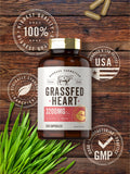 Carlyle Grassfed Heart Supplement capsules on a wooden surface