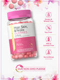 Carlyle Hair, Skin & Nails Gummies on a wooden table