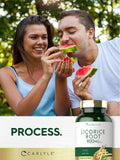 Carlyle Licorice Root capsules in a hand