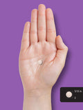 Carlyle Melatonin 5 mg tablets in a hand for size comparison