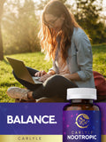 Carlyle Nootropic Supplement Capsules on a wooden table with greenery