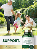 Carlyle Organic Chlorella capsule close-up on wooden table