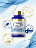 Carlyle Ultra Biotin bottle on a wooden surface