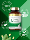 Carlyle Vitamin E 400 IU Softgels with a measuring spoon