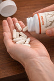 CAUDAN Arctic Herb & Reindeer Organ Blend Capsules in hand