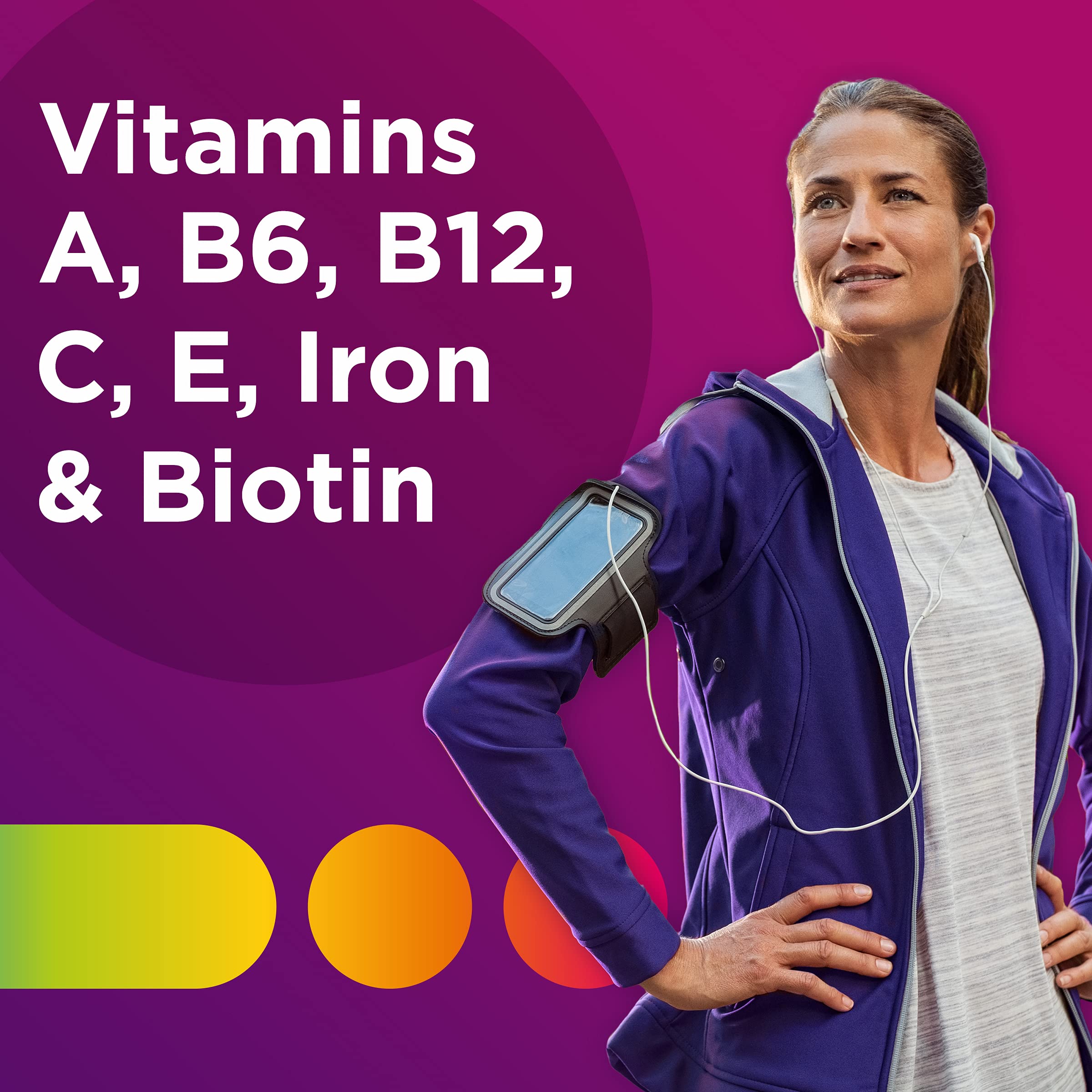 Centrum Multivitamin for Women bottle with a tablet in hand