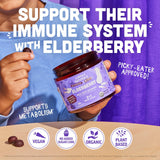 Child holding Llama Naturals Elderberry Gummies with a smile