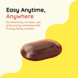 CHILDLIFE ESSENTIALS Elderberry SoftChew Gummies with a glass of water
