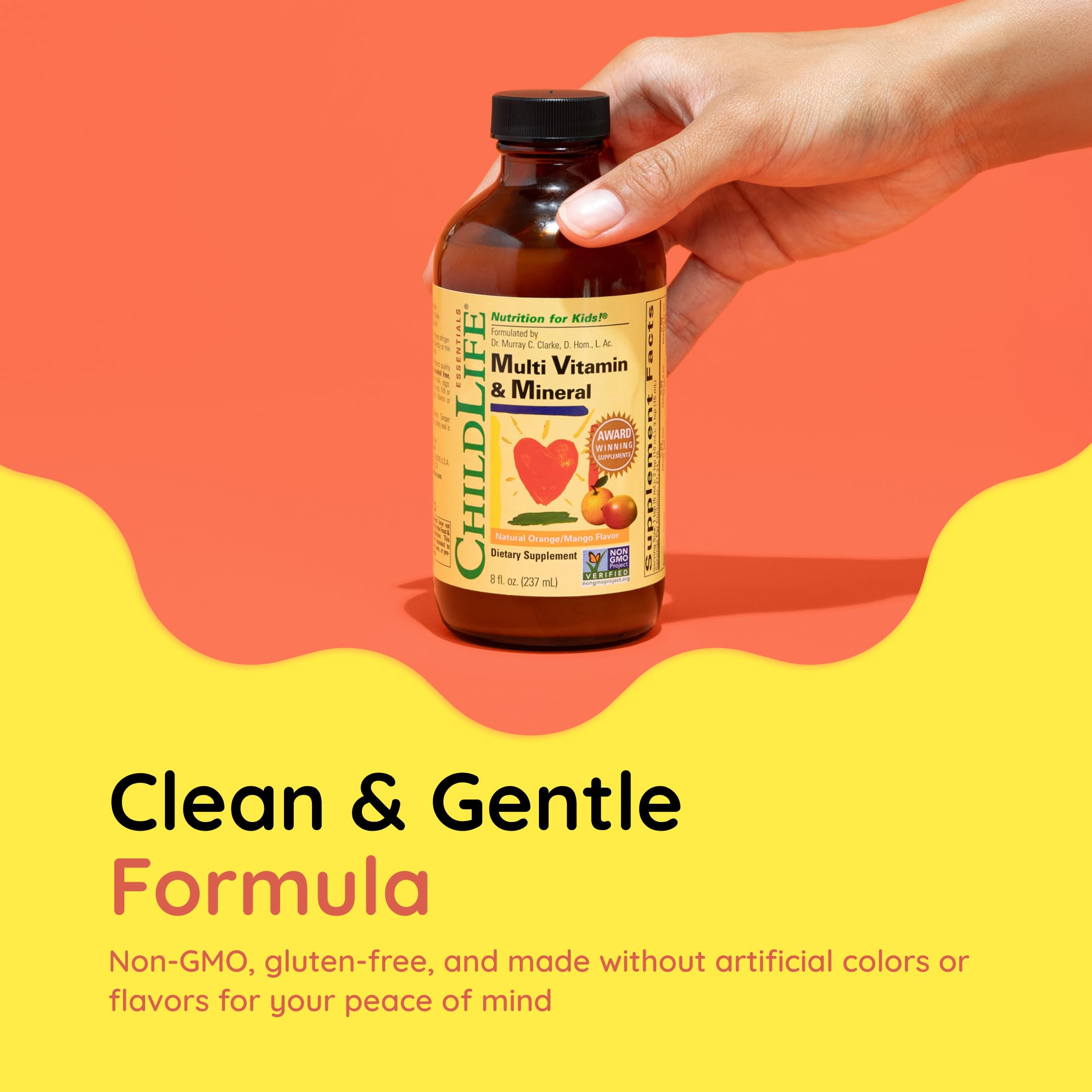 CHILDLIFE ESSENTIALS Multi Vitamin & Mineral liquid being poured into a spoon