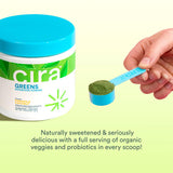 Cira Greens Superfood Powder 70g in a kitchen setting with blender