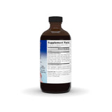 Close-up of Calm Child Herbal Syrup measuring spoon
