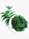 Close-up of dried neem leaves in a bowl