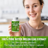 Close-up of FitVitality Bitter Melon Capsules on a wooden table