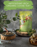 Close-up of Gardenika Organic Green Tea leaves with cinnamon and cloves