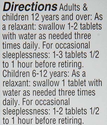 Close-up of Hyland's Sleep Aid Tablets on a wooden surface