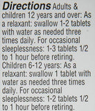 Close-up of Hyland's Sleep Aid Tablets on a wooden surface