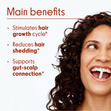 Close-up of Love Wellness Healthy Hair Probiotics capsule