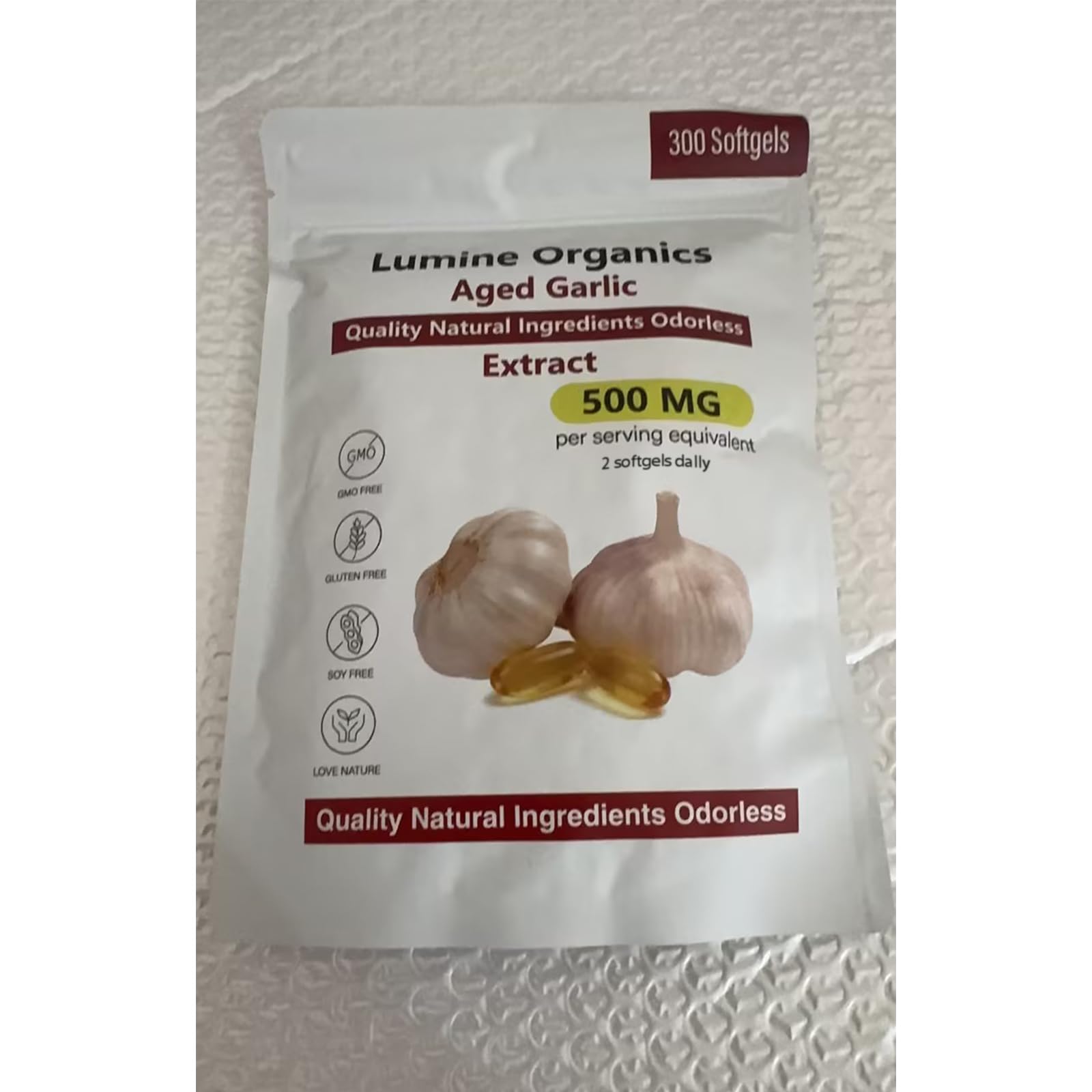 Close-up of Lumine Organics Aged Garlic Extract softgel capsules