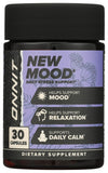 Close-up of ONNIT New MOOD capsules in a hand