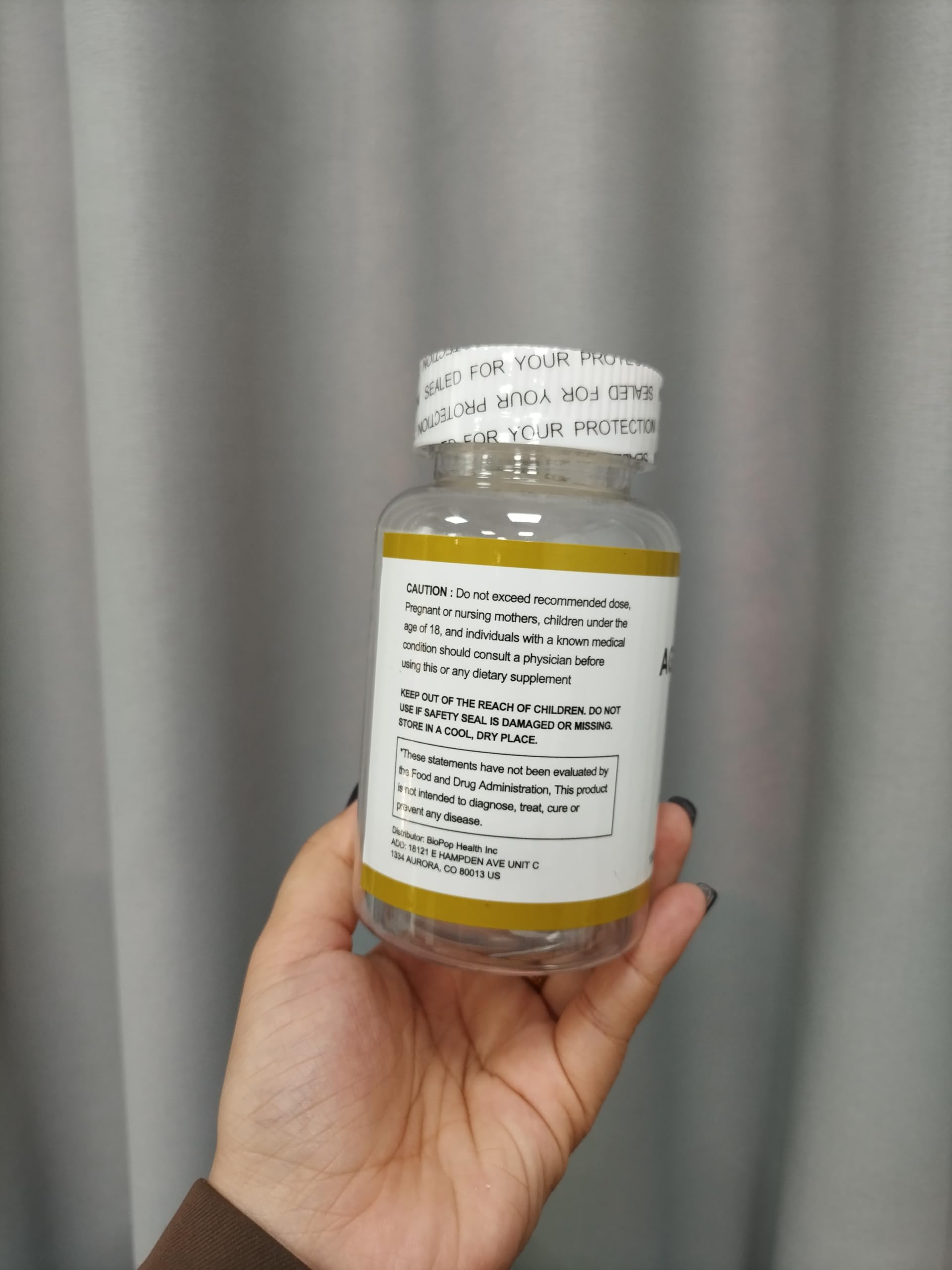 Close-up of RTQSU Aged Garlic Extract Softgels