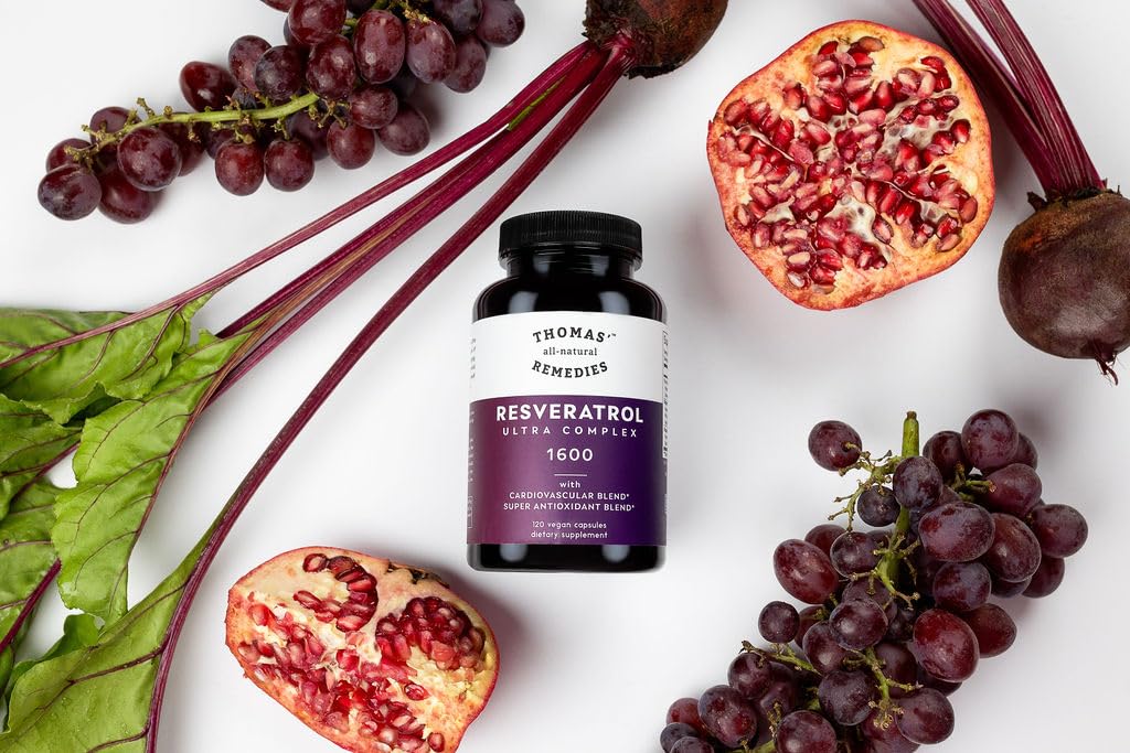 Close-up of Thomas' Resveratrol Plus capsules on a wooden surface