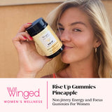 Close-up of Winged Wellness Rise Up Gummies showing gummies