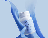 Codex Labs Shaant Clear Skin 2.0 bottle with a measuring spoon