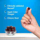 Consult Health Elimi-Fat Gummies on a wooden table
