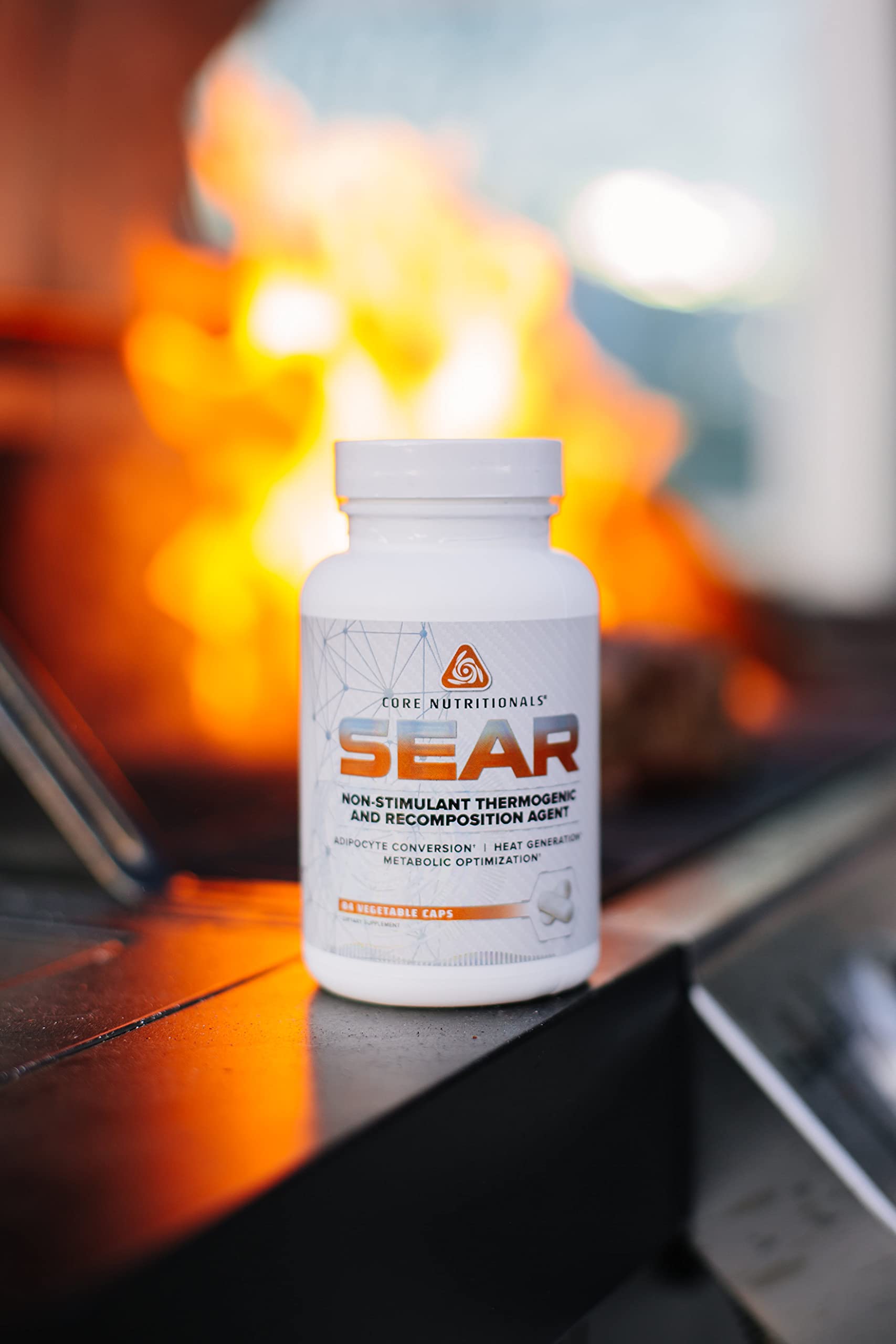 Core Nutritionals SEAR supplement on a gym bench