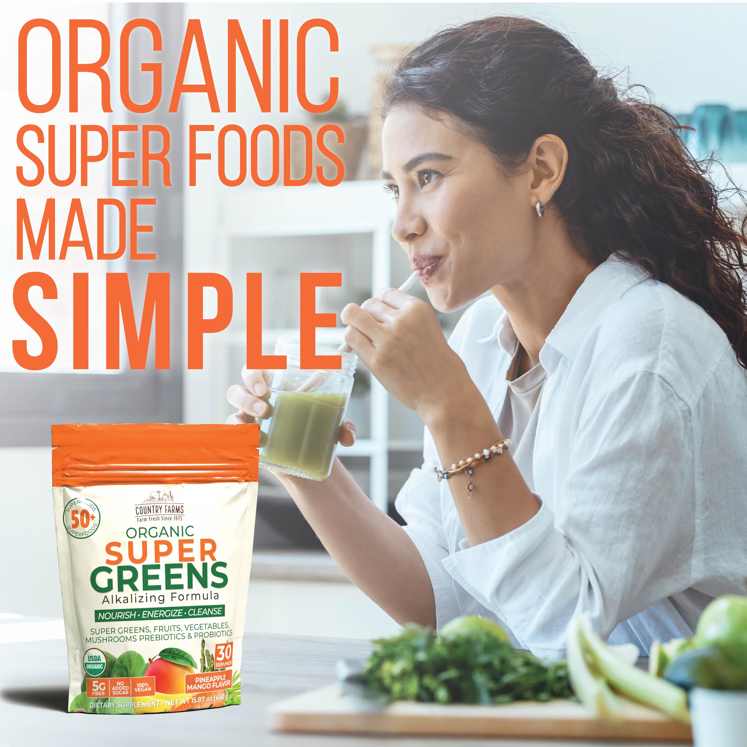 Country Farms Super Greens Pineapple-Mango drink in a glass